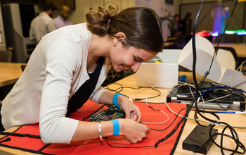 Student working on a circuit board